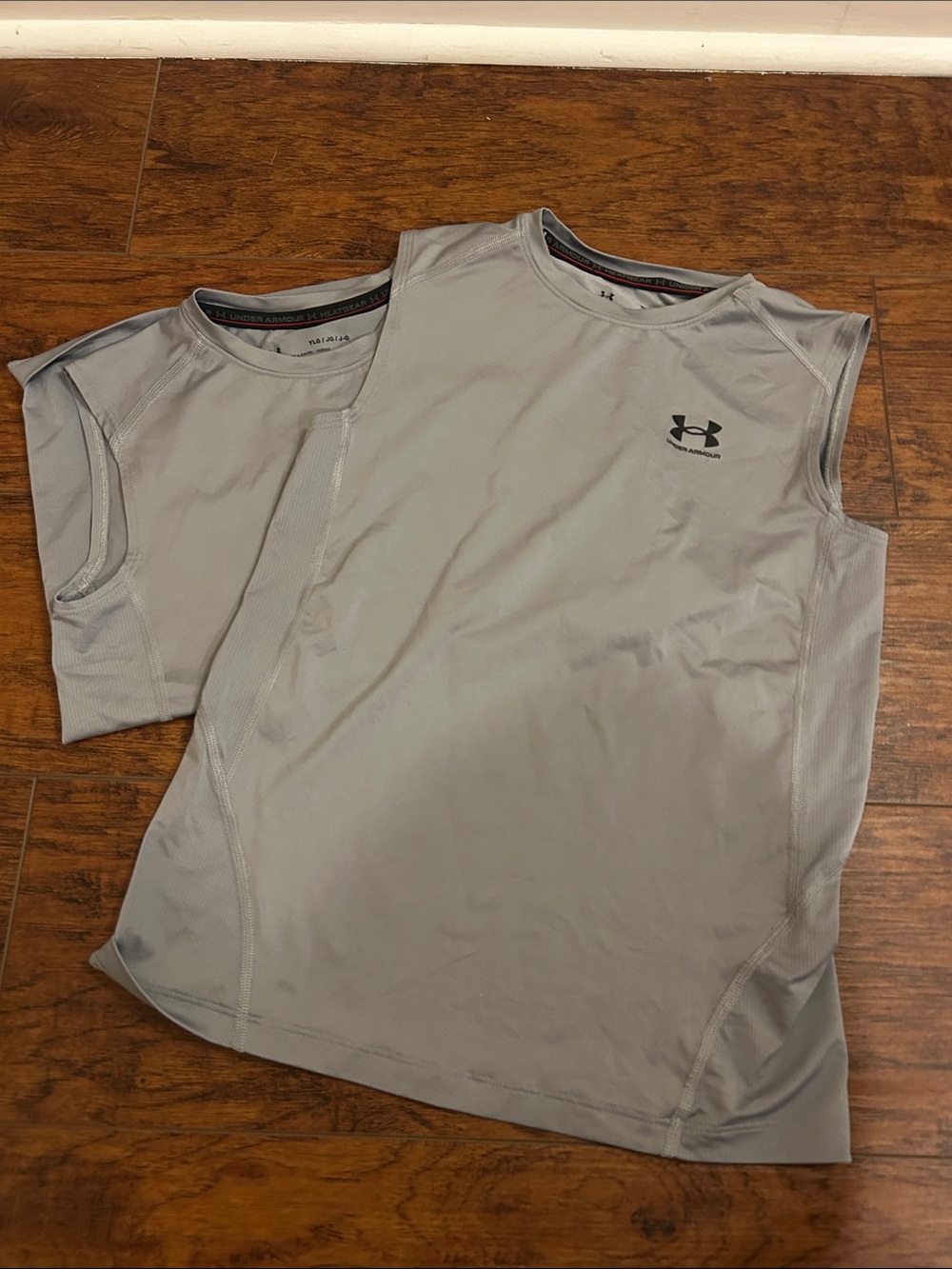 Kids Football Wear - 2 sleeveless UA YL shirts, Nike Dri fit pad shirt & More